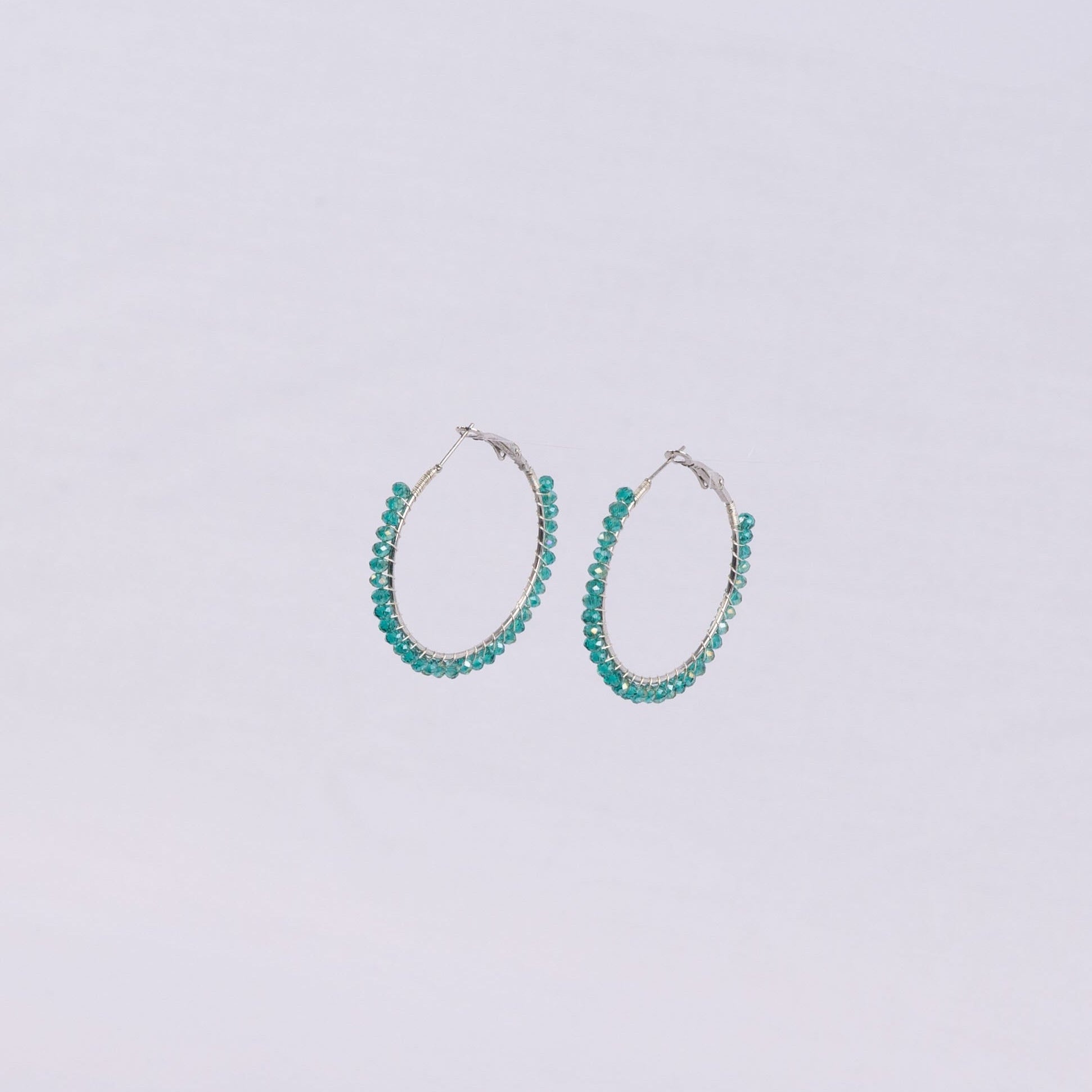Pair of blue translucent beaded hoop earrings