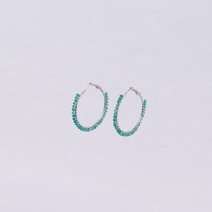 Pair of blue translucent beaded hoop earrings