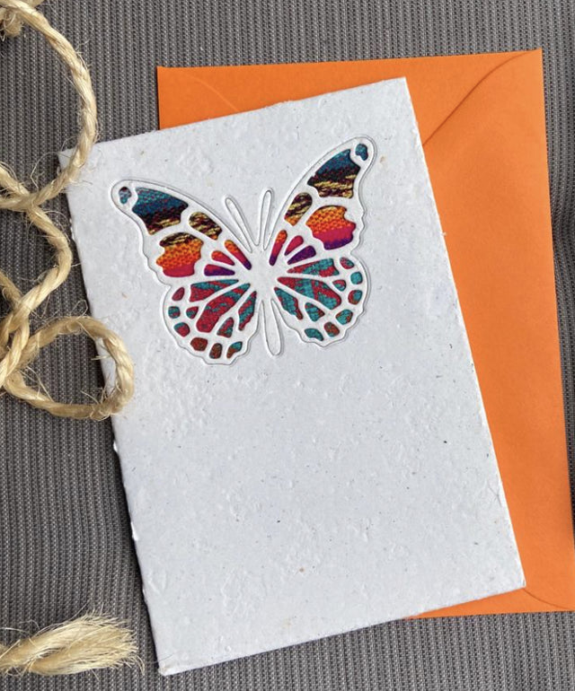 An ethical, handmade intricate butterfly card, made from vibrant Ecuadorian fabrics.