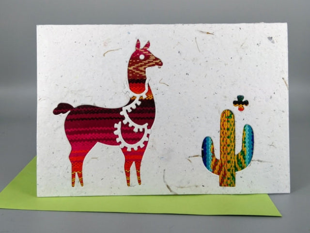 An ethical, handmade llama and cactus card, made from vibrant Ecuadorian fabrics.