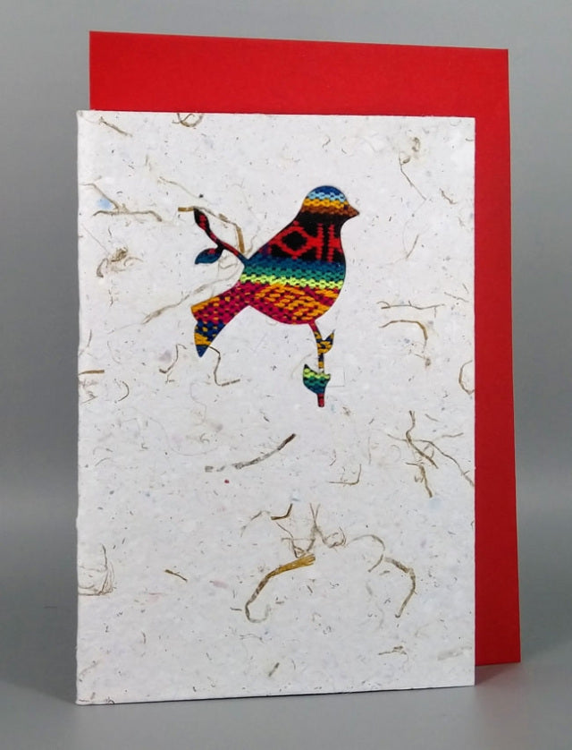 An ethical, handmade small bird card, made from vibrant Ecuadorian fabrics.