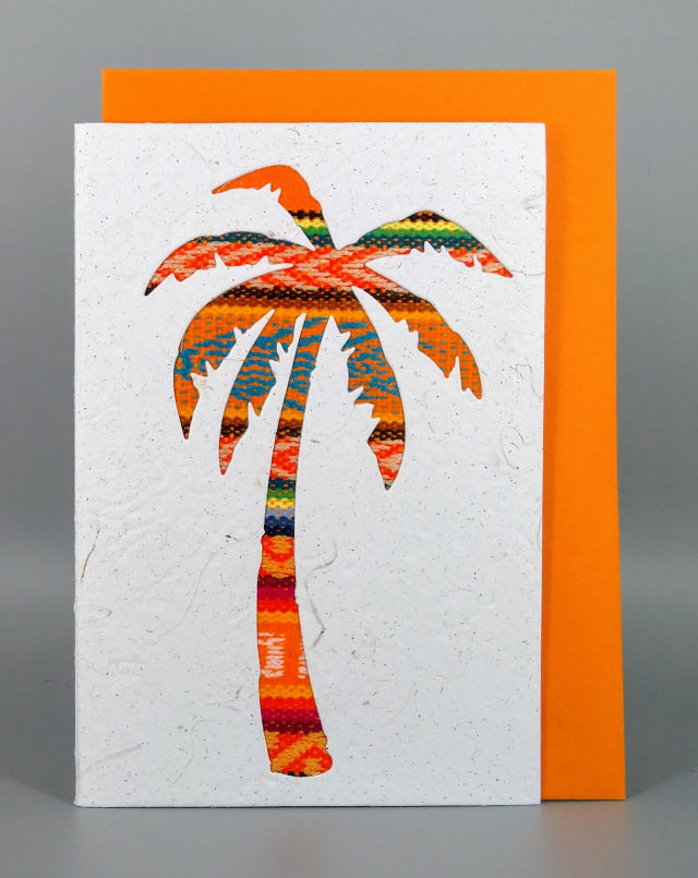 An ethical, handmade Palm tree card, made from vibrant Ecuadorian fabrics.