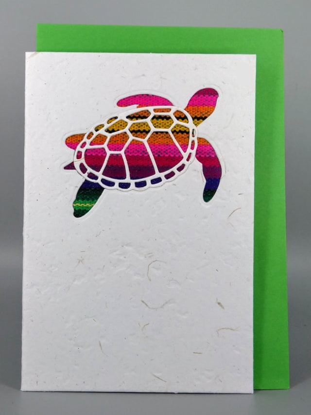An ethical, handmade turtle card, made from vibrant Ecuadorian fabrics.