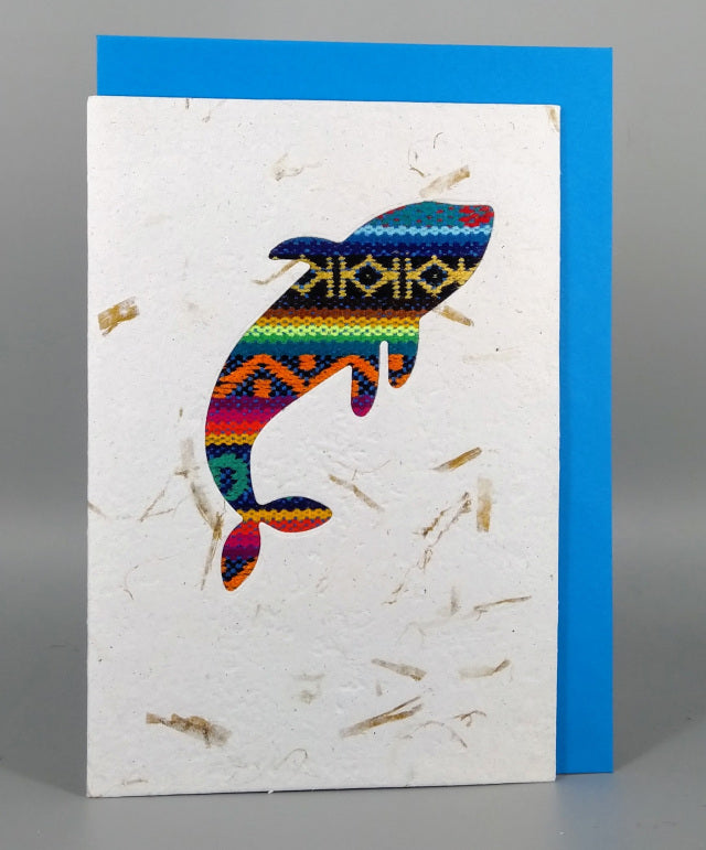An ethical, handmade whale card, made from vibrant Ecuadorian fabrics.