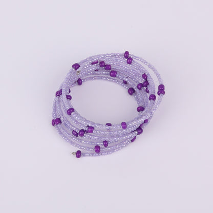Purple beaded spiral bracelet on a white background