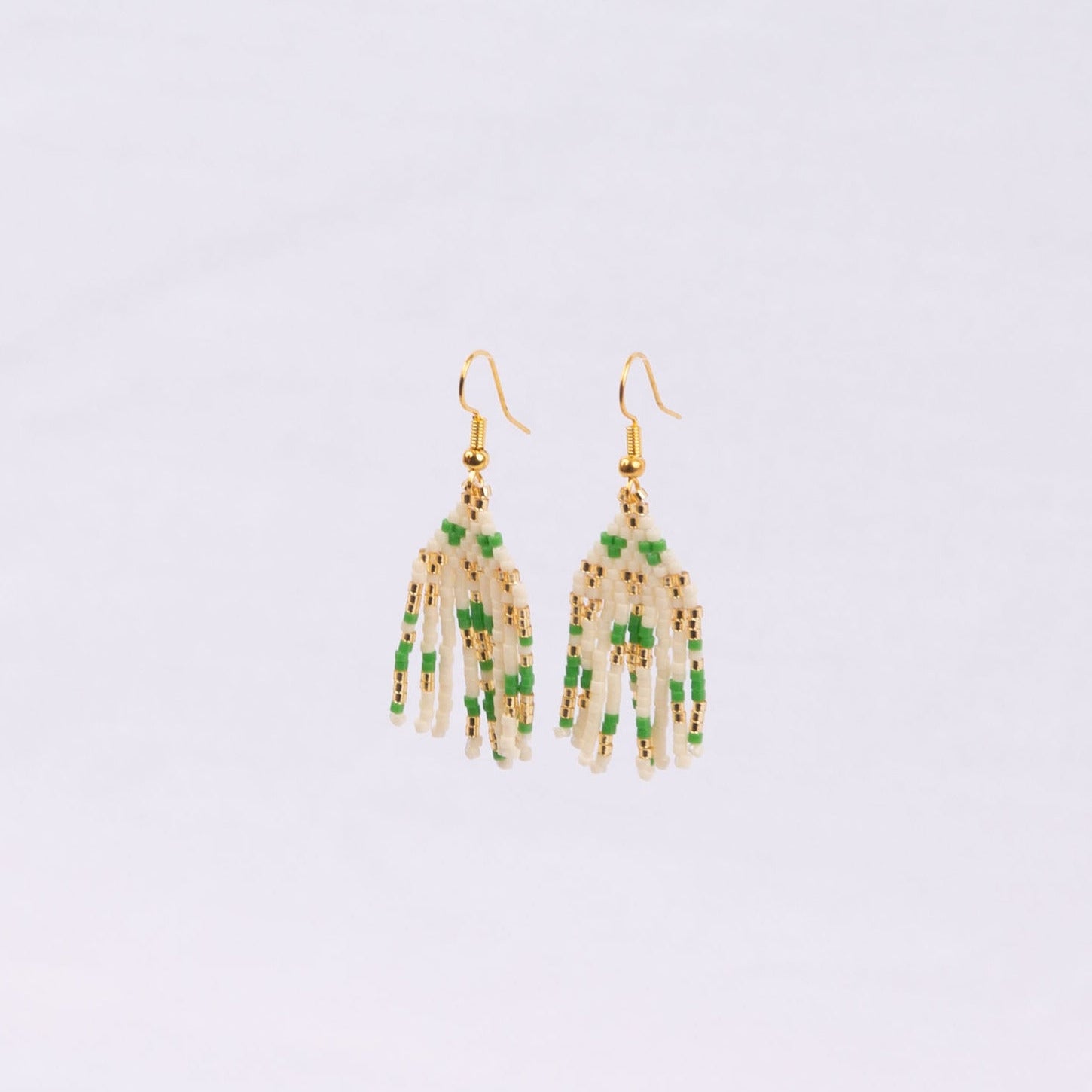 Pair of earrings with green, white and gold beads
