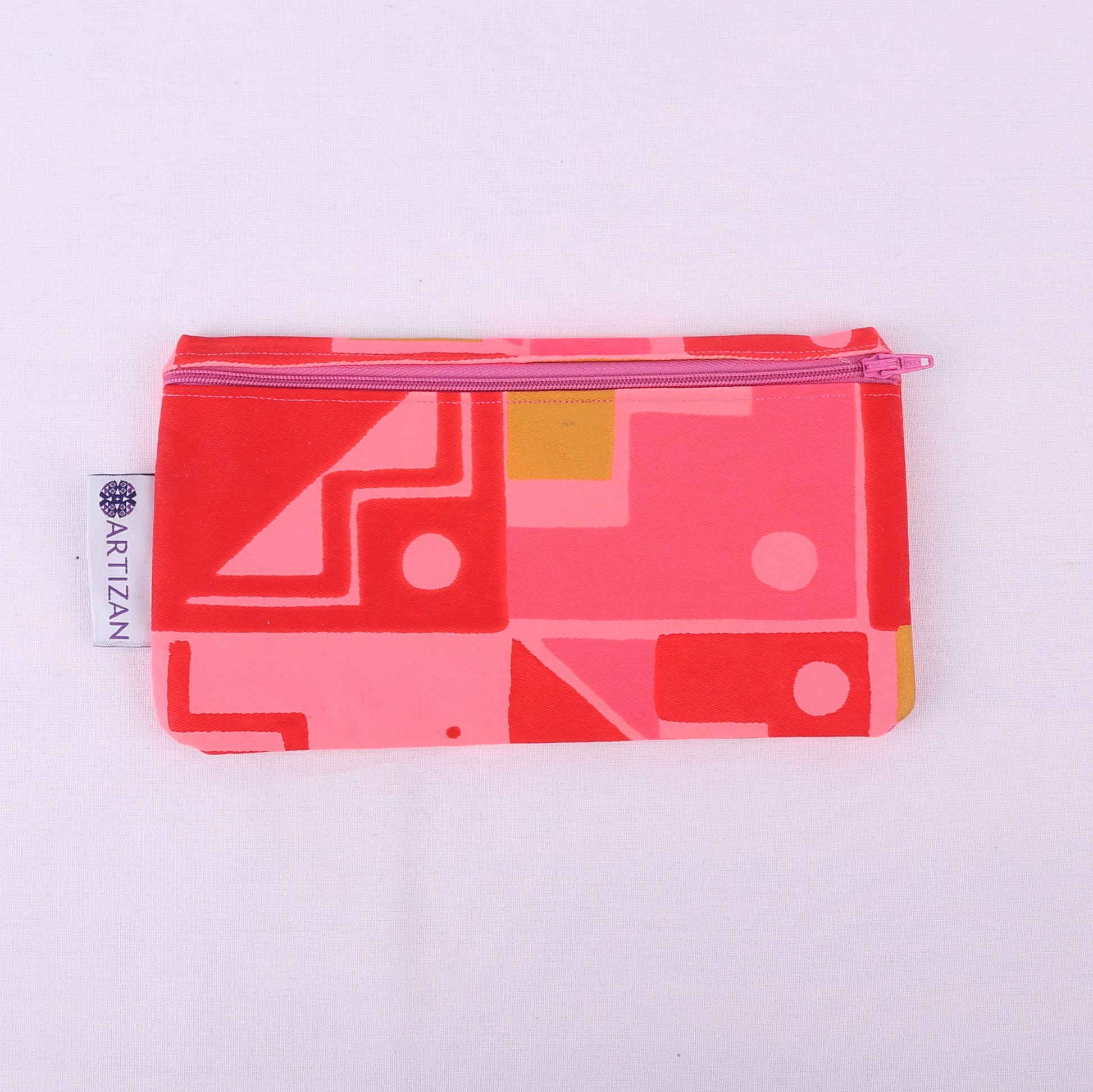 Pink geometric patterned rectangular pencil case with a purple zip.
