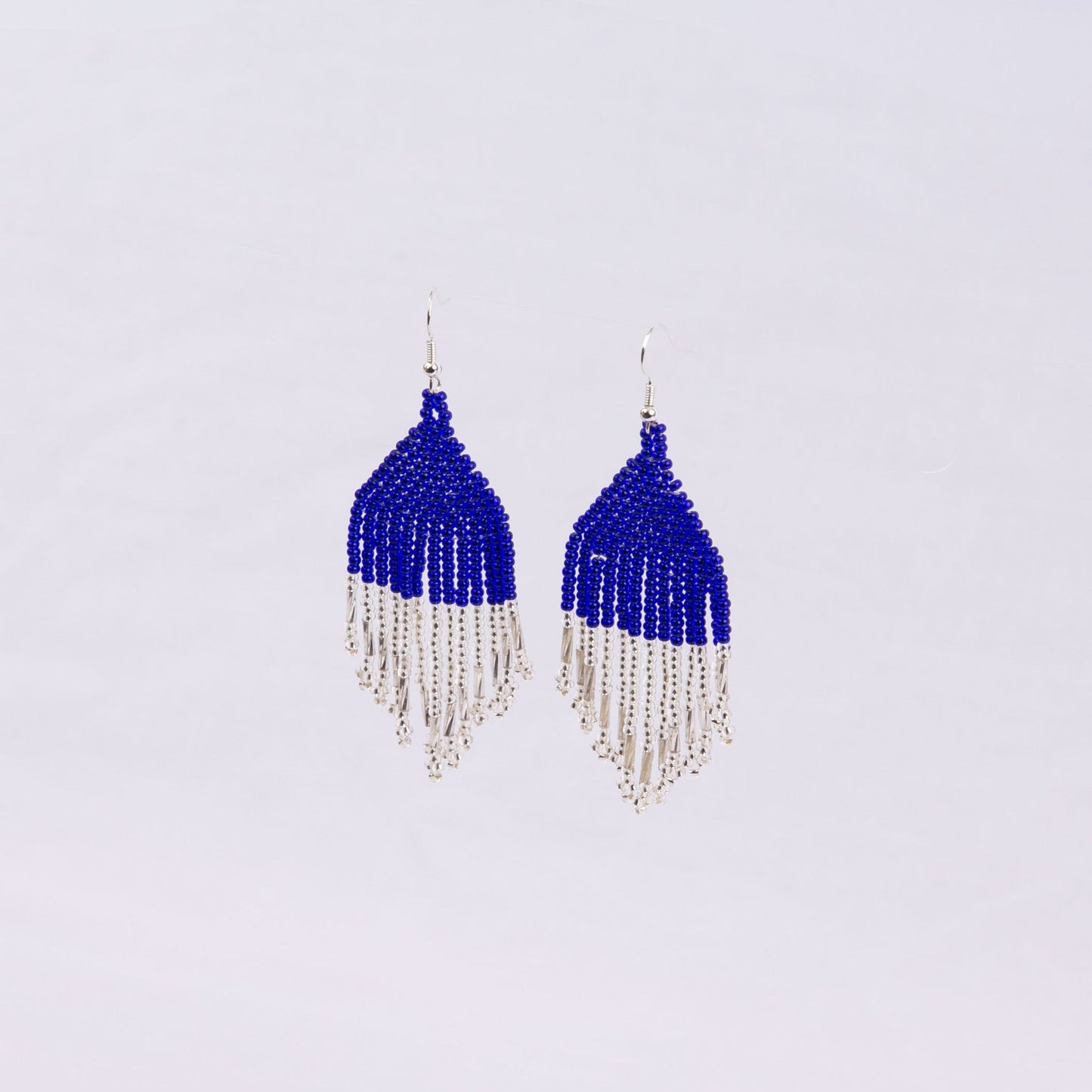 Pair of beaded earrings with blue top and silver fringe