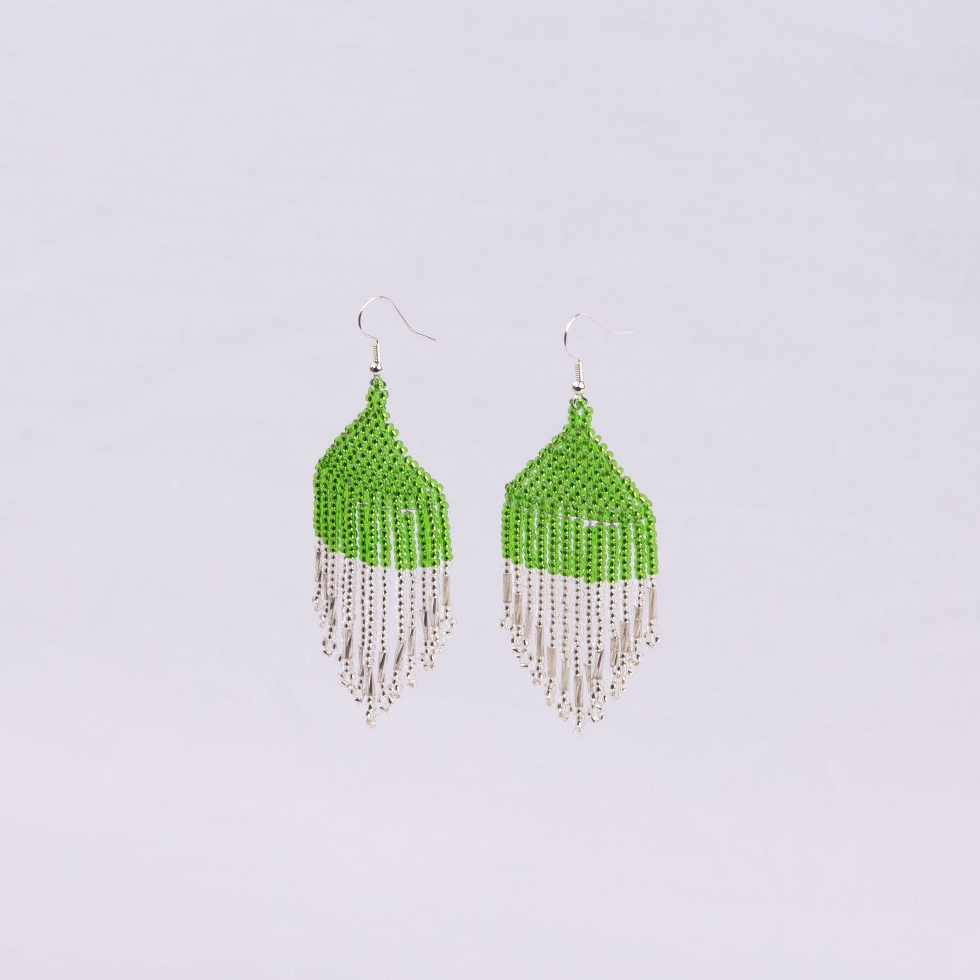 Pair of beaded earrings with green top and silver fringe