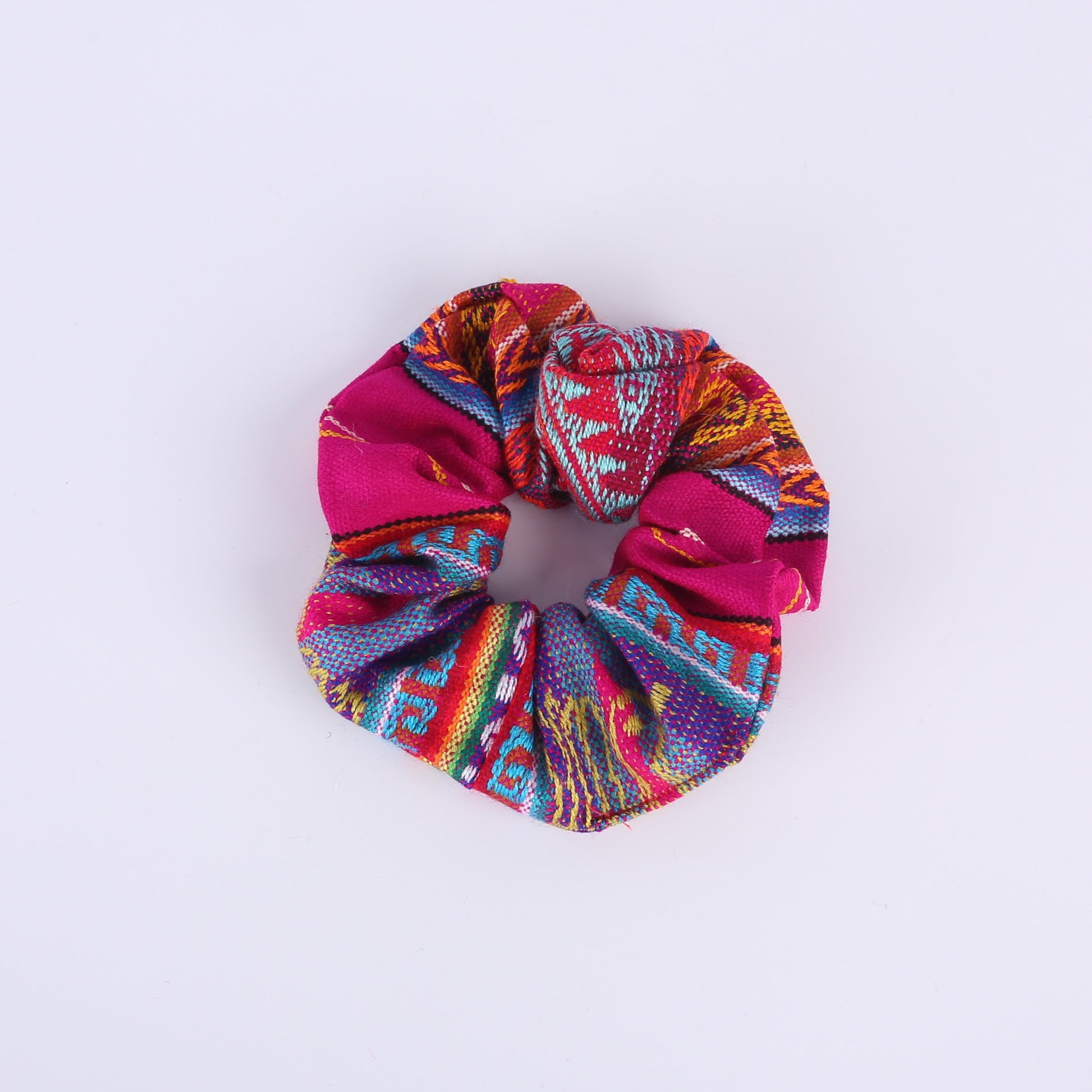 Pink and colourfully patterned scrunchie