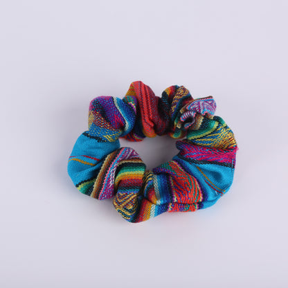 Teal and colourfully patterned scrunchie