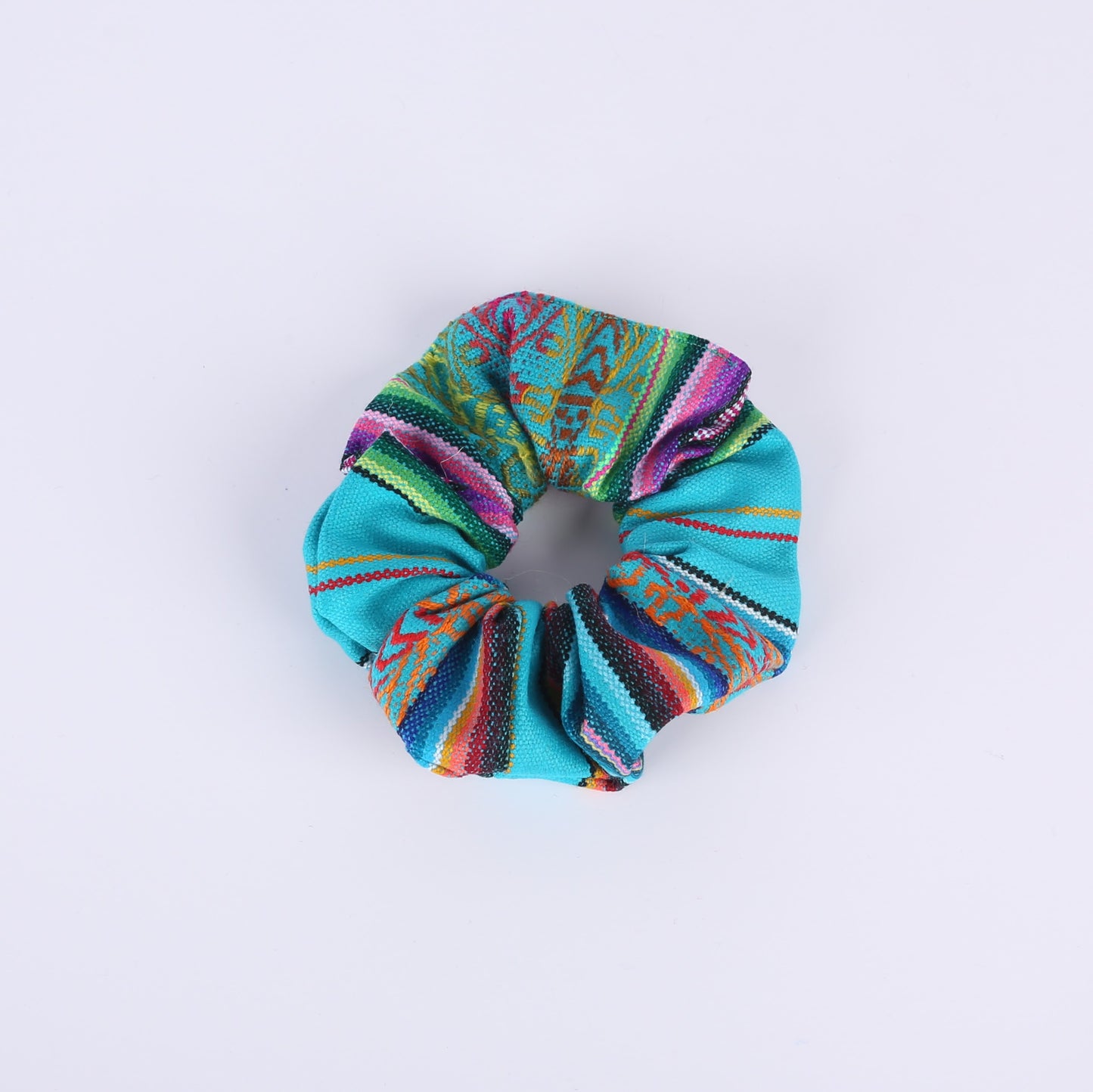 Turquoise and colourfully patterned scrunchie