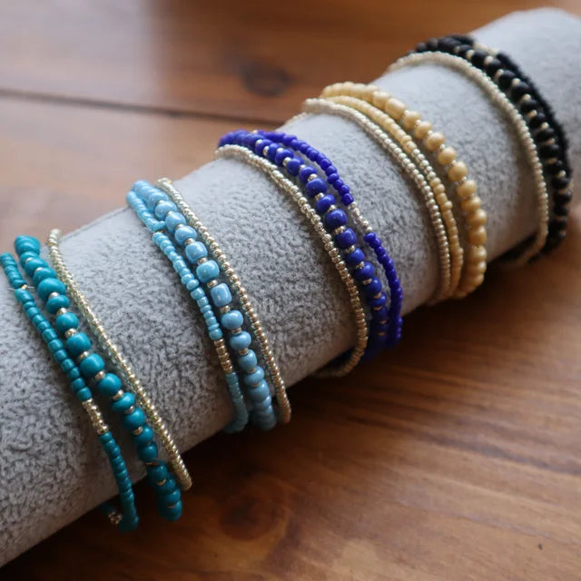 A collection of lizzie trio bracelets showcasing all the different colour variations 